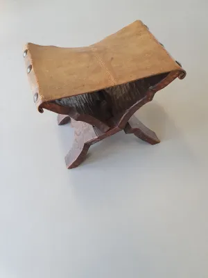 Small brutalist folding stool with leather seat 1950s